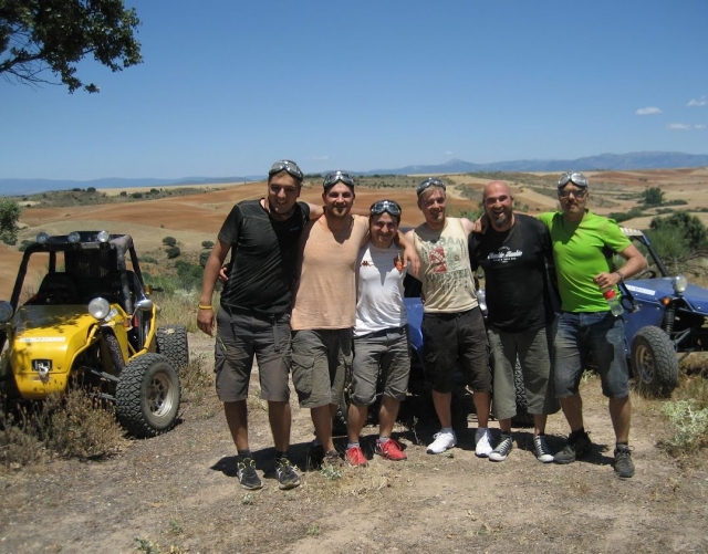  Friends in the countryside with vehicles 